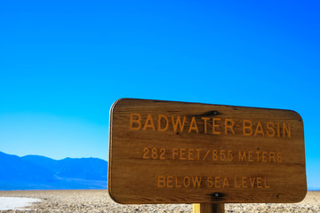 Badwater Basin sign with information about elevation at Death Valley National Park, California, USA