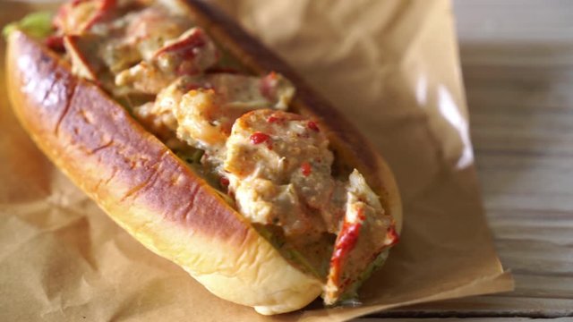 homemade lobster roll with chips and sauce
