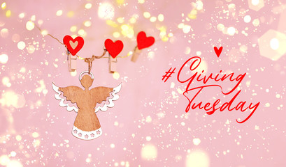 GivingTuesday background. global philanthropy day of charitable giving. give help, donations, support concept. angel decor, clothespins hearts and text 