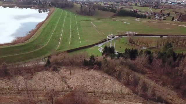 Aerial: Flying in front of a monument to the victims of World War II. Filming wonderful Slovenian autumn countryside with drone.