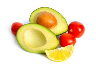 Avocado with tomatoes and lemon. Ingredients for Guacamole. Isolated
