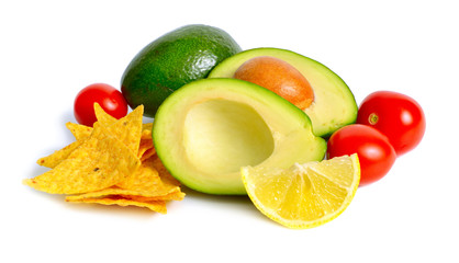 Avocado with tomatoes and lemon. Ingredients for Guacamole. Isolated