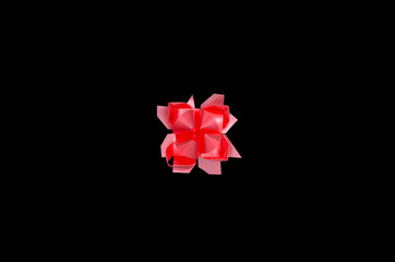 Red gift bow isolated on the black background with clipping path