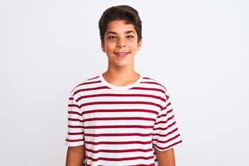 Handsome teenager boy standing over white isolated background with a happy and cool smile on face. Lucky person.