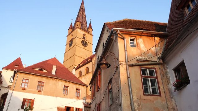 SIBIU, ROMANIA, JULE 18, 2019: cityscape with old houses of historical center of Sibiu town at the evening time, Transylvania, Romania
