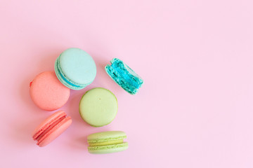colorful macaroons on pink background