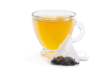 Cup of green tea with jasmine and pyramid tea bag isolated on white