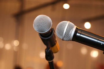 Naklejka na ściany i meble Microphone. Microphone on stage. Wireless sound equipment.Selective focus