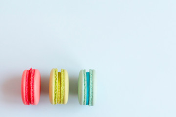 colorful macaroons on blue background