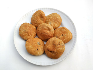 indian desert fresh kachori put in white plate isolated on white background