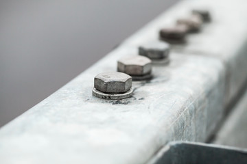 Gray bolts connection, close-up photo