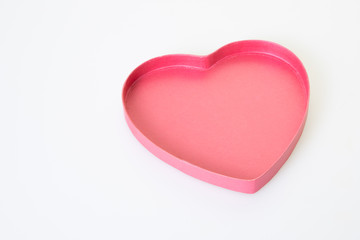 pink gift box in heart shape on white background