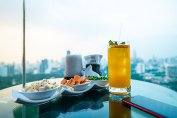 Orange juice drinking on roof top bar