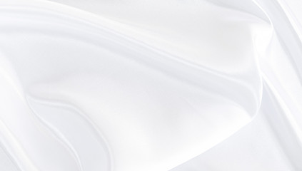 White gray satin texture that is white silver fabric silk background with beautiful soft blur pattern natural.