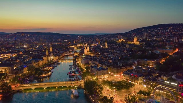sunset sky night illuminated flight over zurich riverside aerial panorama 4k timelapse switzerland 