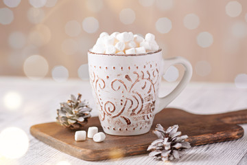 Obraz na płótnie Canvas Mug with coffee and marshmallow on wooden table . Cozy christmas composition. Hygge concept Soft focus