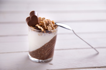 Delicious breakfast, cocoa chia pudding with yogurt and cereals