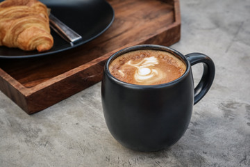A cup of coffee with latte art on top