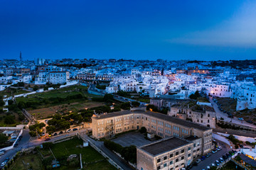 Obraz premium aerial view at dusk, Mountain village, Ostuni, Apulia, Southern Italy