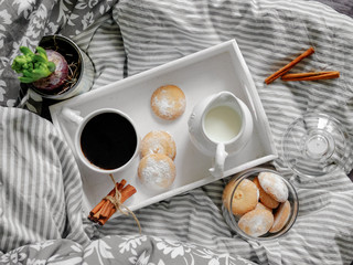 breakfast in bed. top view. Coffee with cookies on a tray