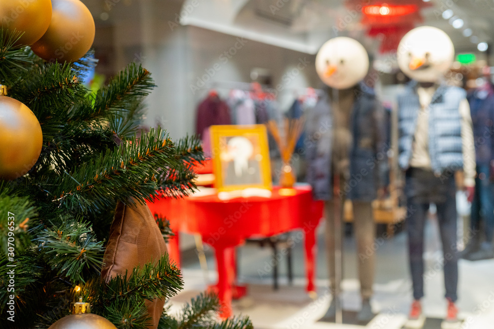 Wall mural moscow. russia. december 2, 2019. mannequins in a shop window. christmas window dressing.