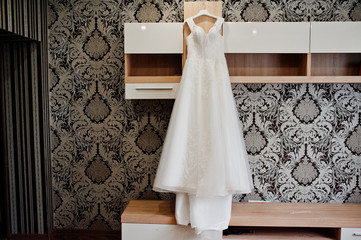 Elegant white wedding dress at bride morning.