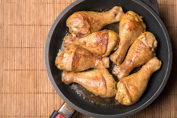 Chicken drumsticks baked on a pan