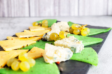 cheese platter on a cutting Board