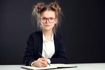 Portrait of cute little schoolgirl