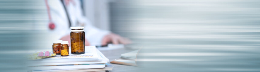 Desk of doctor in medical office; panoramic banner