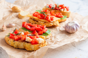 Italian bruschetta with cheese and tomatoes