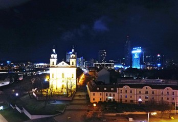 Fototapeta premium Gediminas' tower and Vilnius downtown at night. Drone footage.