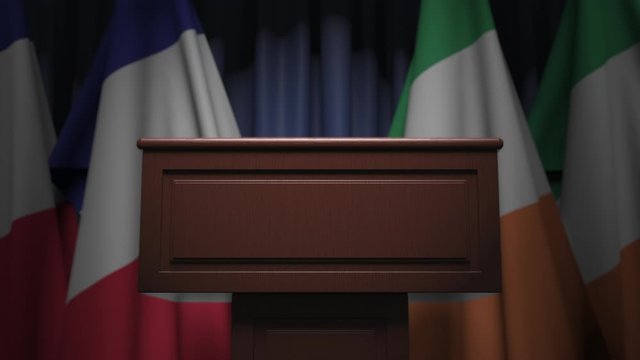 Flags of France and Ireland and speaker podium tribune. Political event or negotiations related conceptual 3D animation