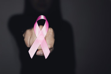 Pink ribbon for breast cancer awareness, symbolic bow color raising awareness on people living with...