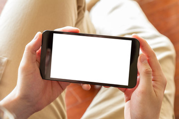 man using mobile phone indoor, close up