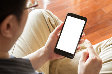 man using mobile phone indoor, close up