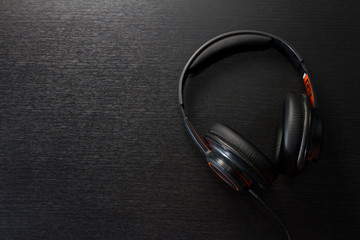 headphones on black table or background. flat lay. table top view. copy space. - musical concept
