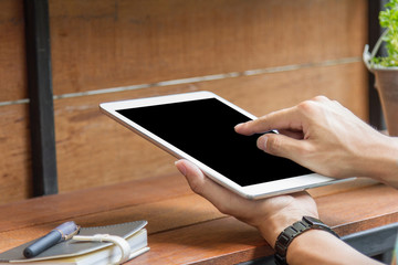 man using tablet computer with blank screen