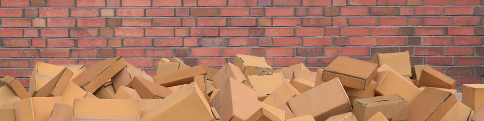 Many boxes as packaging in front of a wall