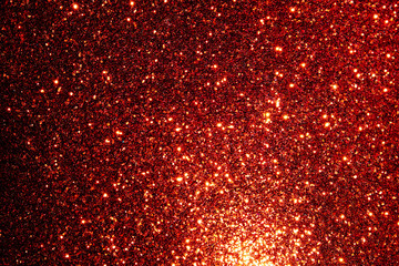 red Sparkling Lights Festive background with texture. Abstract Christmas twinkled bright bokeh...