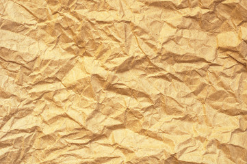 Brown yellow crumpled paper texture background