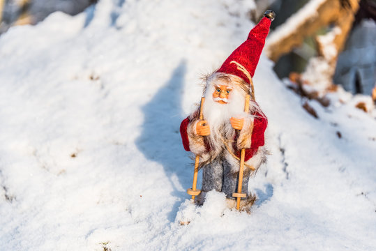 Santa Doll with Skis on Snow for Christmas