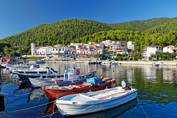 Fototapeta na wymiar The port in Hovolo of Skopelos, Greece