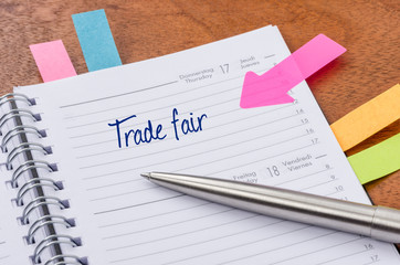 Daily planner with the entry Trade fair