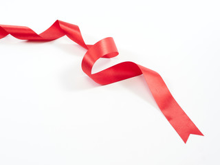 Red ribbon curved isolated on white