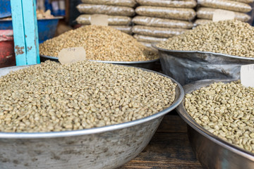 Green unroasted coffee beans for sale in a market