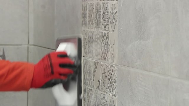 Grouting tiles in bathroom