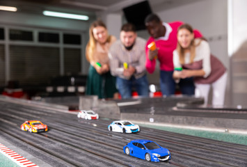 Models of race cars on track