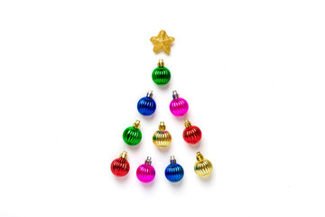 Creative Christmas tree made of colorful bauble and golden star decoration isolated on white background. Merry christmas, Happy New year concept. Flat lay Top view