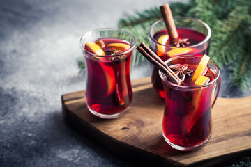 Christmas mulled wine. Traditional festive drink with decorations and fir tree